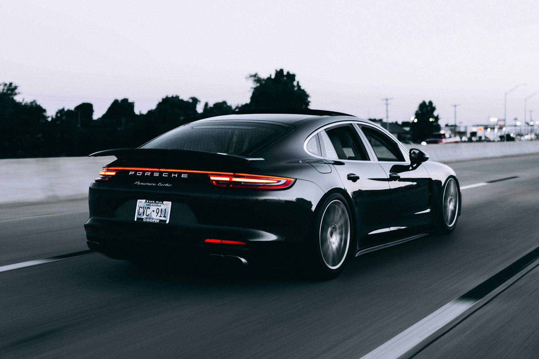 Dark sports car on an open road